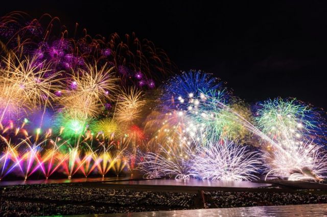 Gion Kashiwazaki Festival with large scale fireworks display over the ocean